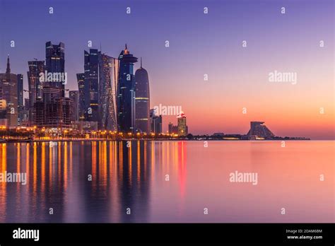 The skyline of Doha, Qatar during sunset Stock Photo - Alamy