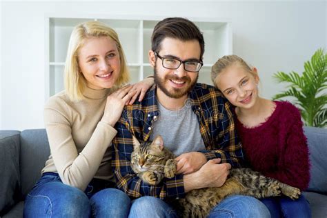 Family with a cat stock photo. Image of house, lifestyle - 99305354