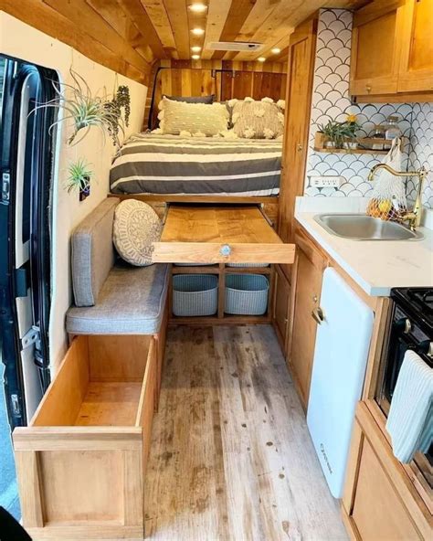 the interior of a small camper with wood flooring and walls painted ...