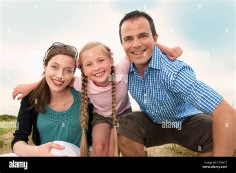 Family smiling together outdoors Stock Photo - Alamy