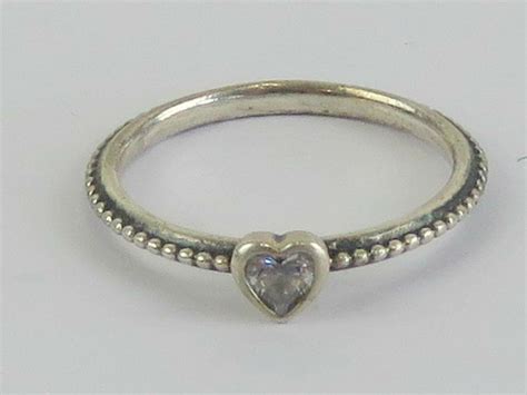 Sold at Auction: A silver Pandora ring having heart set with white ...