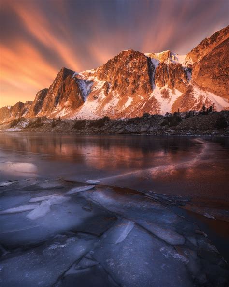 A stunning light display during sunrise at the Snowy Mountain Range in ...