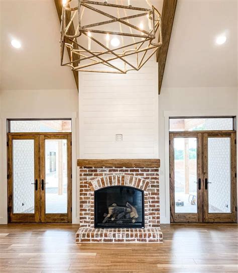 Red Brick Fireplace in Living Room With Wood Accents - Soul & Lane