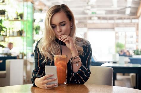 Premium Photo | Beautiful woman drinking a cocktail