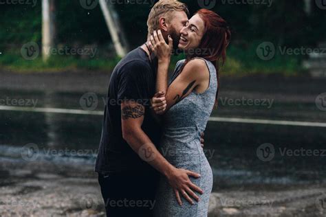 beautiful couple hugging in the rain 11487801 Stock Photo at Vecteezy