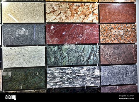 Colorful samples of a stone tile in store. Marble and granite flooring ...