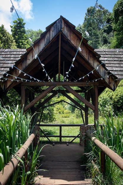 Premium Photo | Hanging lights on a wooden gazebo