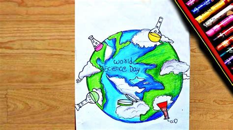 a drawing of the earth with crayons and colored pencils next to it