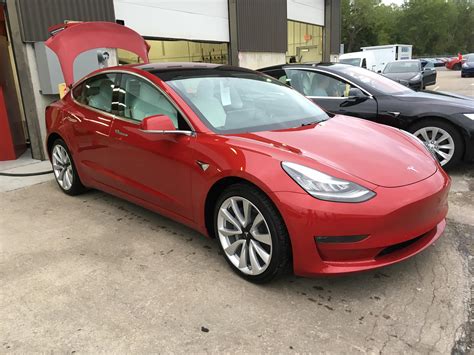 My mom’s Tesla model 3 that we got late September. Red, 19 inch wheels ...