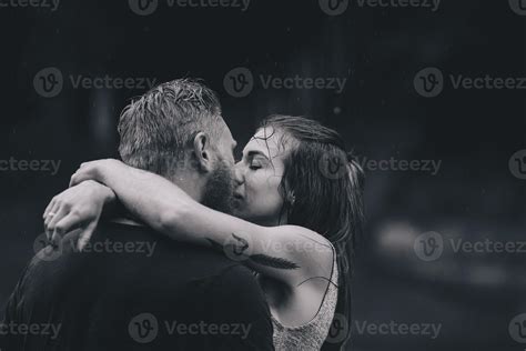 beautiful couple hugging in the rain 11741556 Stock Photo at Vecteezy