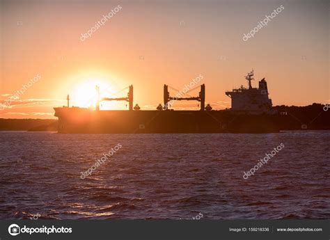 Silhouette of Cargo Ship — Stock Photo © paulbradyphoto #159218336