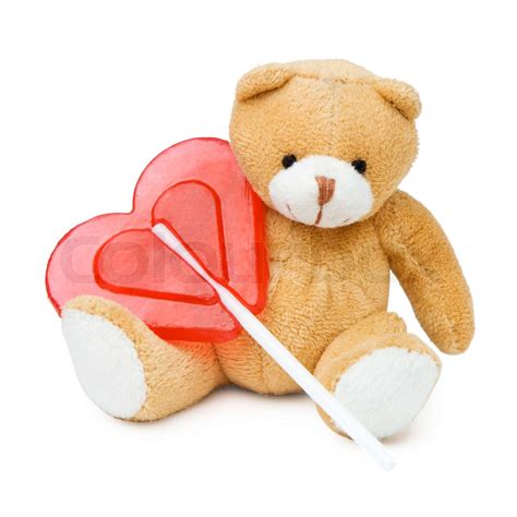 Small cute brown teddy bear with red heart | Stock image | Colourbox