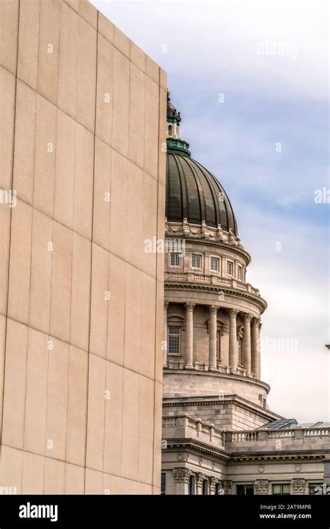 The famous dome of the Utah State Capitol Building viewed behind a wall ...