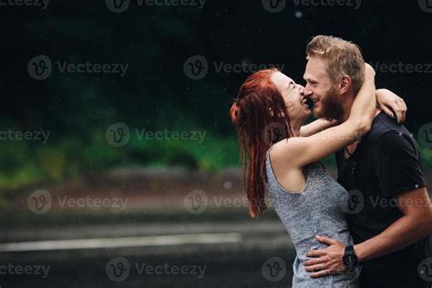 beautiful couple hugging in the rain 11531218 Stock Photo at Vecteezy