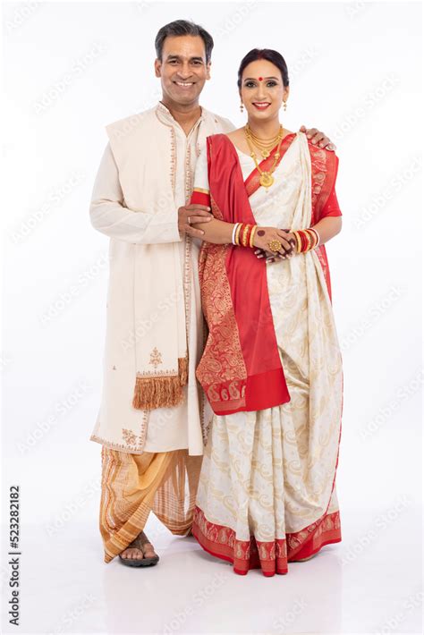 Portrait of happy bengali couple in traditional clothing on occasion of ...