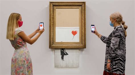 A partially shredded Banksy sells at auction for $25.4 million : NPR