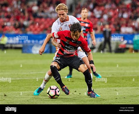 Jumpei Kusukami of the Western Sydney Wanderers manages to get around ...