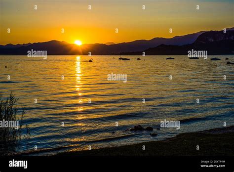 Lake sunset Italy Stock Photo - Alamy