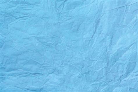 Premium Photo | Texture of crumpled light blue wrapping paper