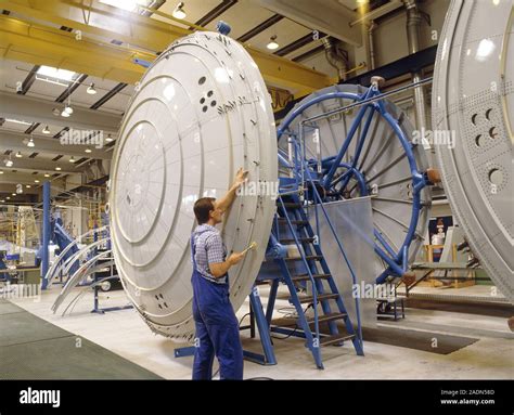 POSED BY MODEL. Aircraft construction. Technician assembling the ...