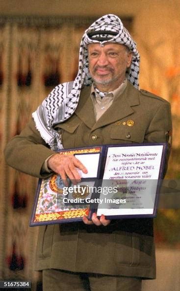 Palestinian leader Yasser Arafat displays his Nobel Peace Prize... News ...