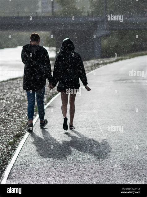 Couple Holding Hands In The Rain Wallpaper