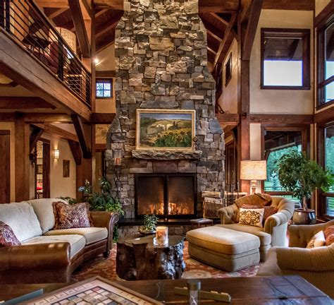 Dramatic wood burning stone fireplace is the living rooms focal point ...