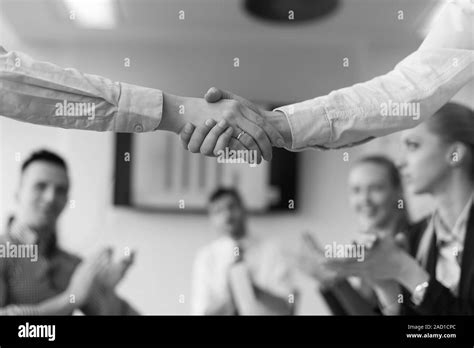 Business womans handshake Stock Photo - Alamy