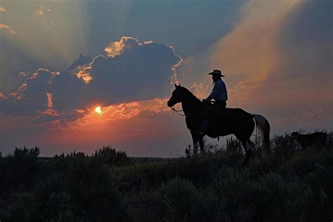 Cowboy Sunset Photograph by Brian Wartchow - Pixels