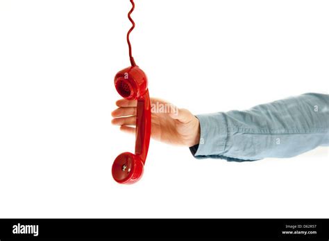 Male hand grabbing a red phone. isolated on white Stock Photo - Alamy