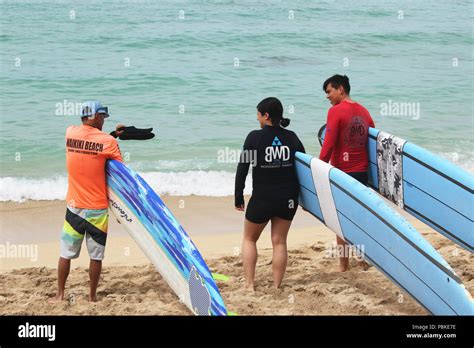 Waikiki beach surfing hi-res stock photography and images - Alamy