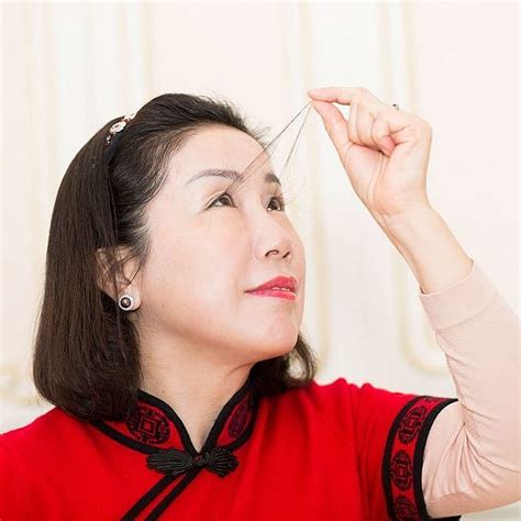 Woman with the world's longest eyelashes breaks her own record with 8 ...