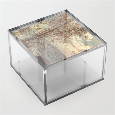 an acrylic box with wood and glass in the top section on a white background