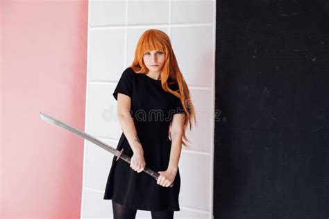 Portrait of a Beautiful Girl with a Japanese Sword Cosplayer Anime ...