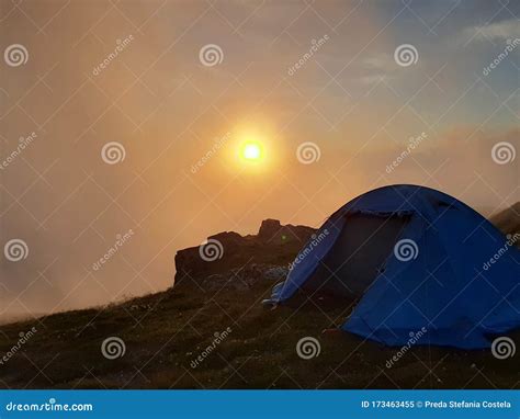 Tent sunrise in the sky stock image. Image of bucegi - 173463455