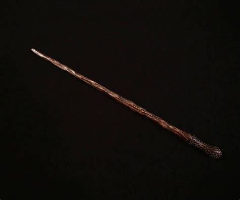 The wand is hand carved out of Elm Wood, is 12 ¾ inches long, possess ...