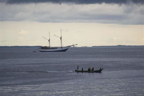 Sorong, West Papua, Indonesia, September 30th 2021. The villagers cross ...