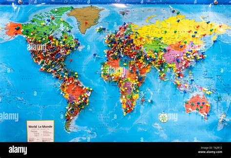 Push pins marking locations on a world map Stock Photo - Alamy