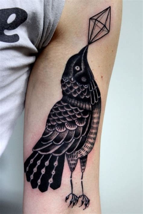 Old school black and white crow tattoo on arm with geometrical figure ...