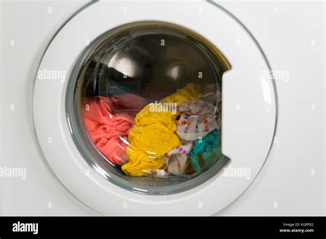 Washing machine is washing clothes Stock Photo - Alamy