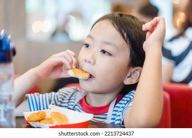 1,123 Kid Eating Nuggets Images, Stock Photos & Vectors | Shutterstock