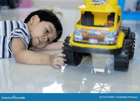 Lovely Asian Baby Boy Playing with Yellow Toy Car on Floor at Home ...