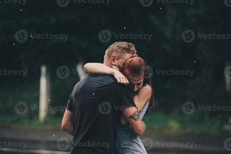 beautiful couple hugging in the rain 11739013 Stock Photo at Vecteezy