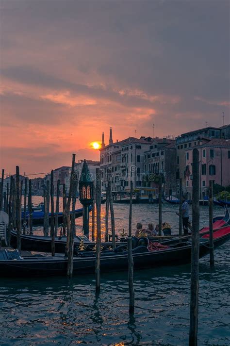 Gondola with Tourists and Gondolier at Sunset in Venice. Italian Travel ...