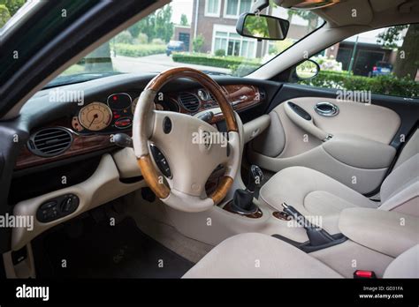 Rover 75 car interior with a walnut dashboard color green Stock Photo ...