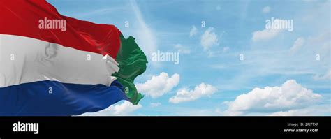 flag of Dutch Creole peoples Griqua people at cloudy sky background ...