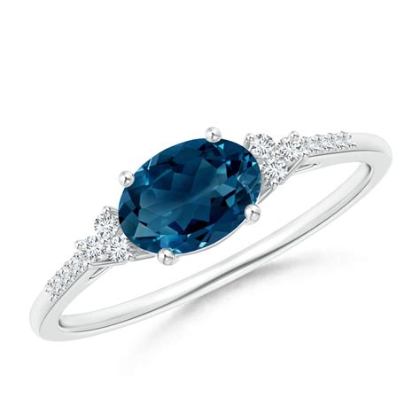 Horizontally Set Oval London Blue Topaz Ring with Diamonds | Angara