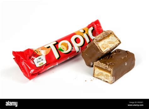 Topic chocolate bar on white background with open cut up bar by the ...