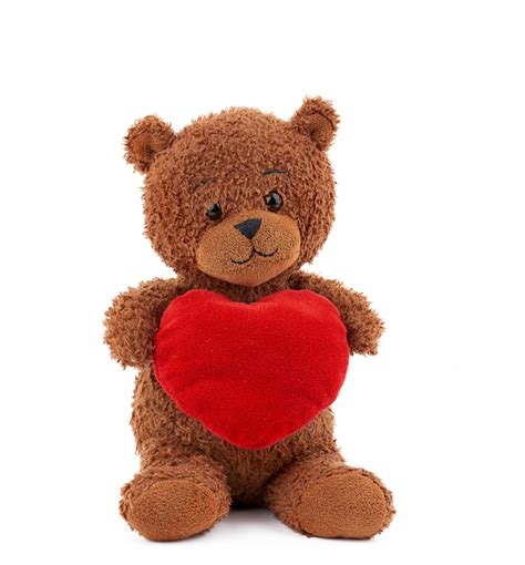 Premium Photo | Cute brown teddy bear holding a big red heart