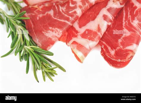 Italian lonza on white background Stock Photo - Alamy